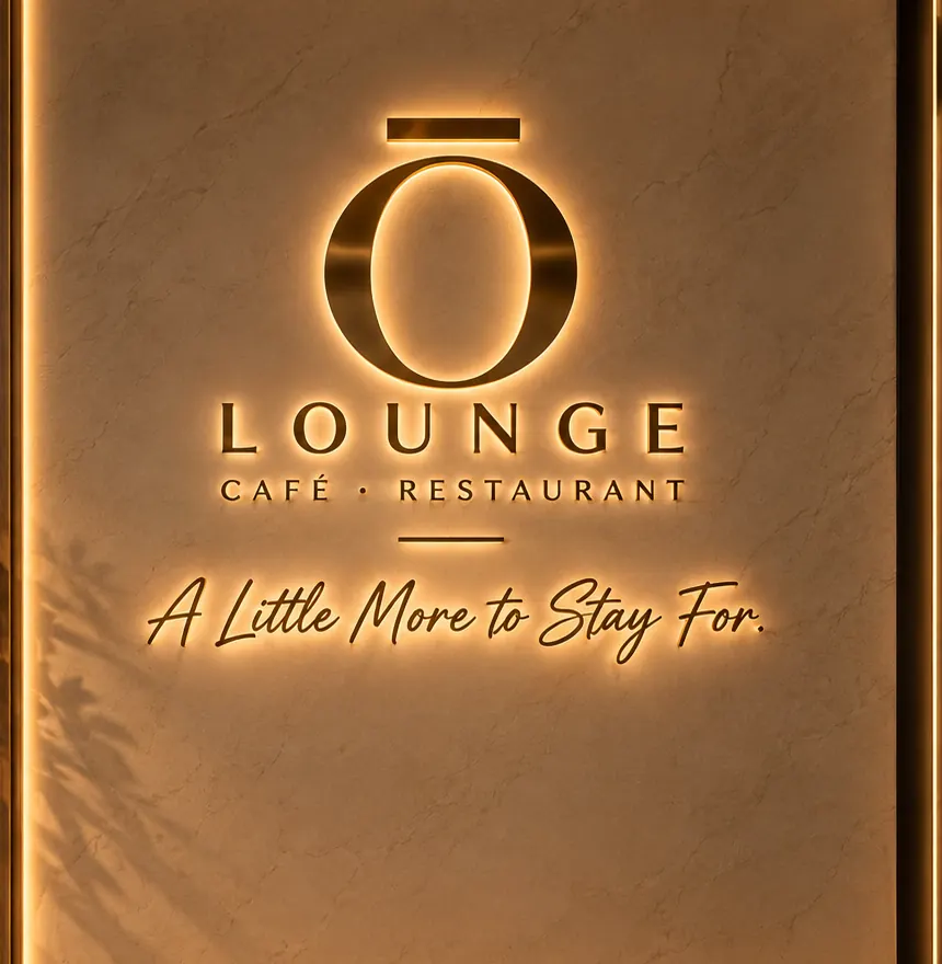 The glowing Ō Lounge sign: Café · Restaurant — A Little More to Stay For.